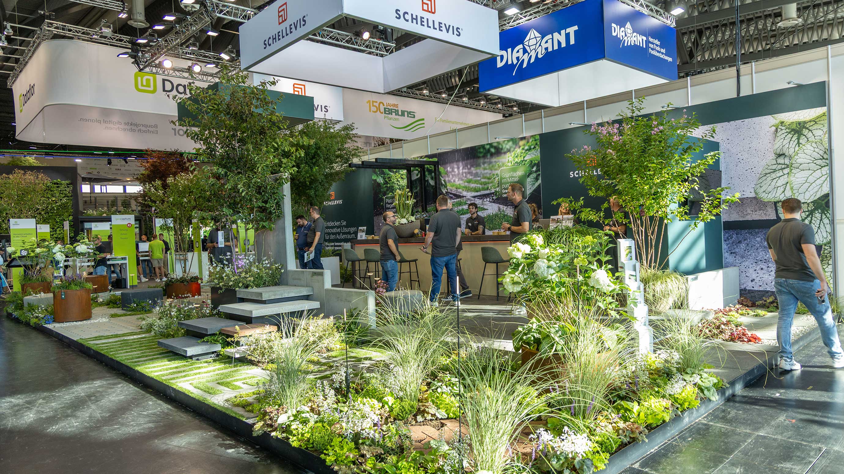A green exhibition booth with lots of plants at GaLaBau 2026